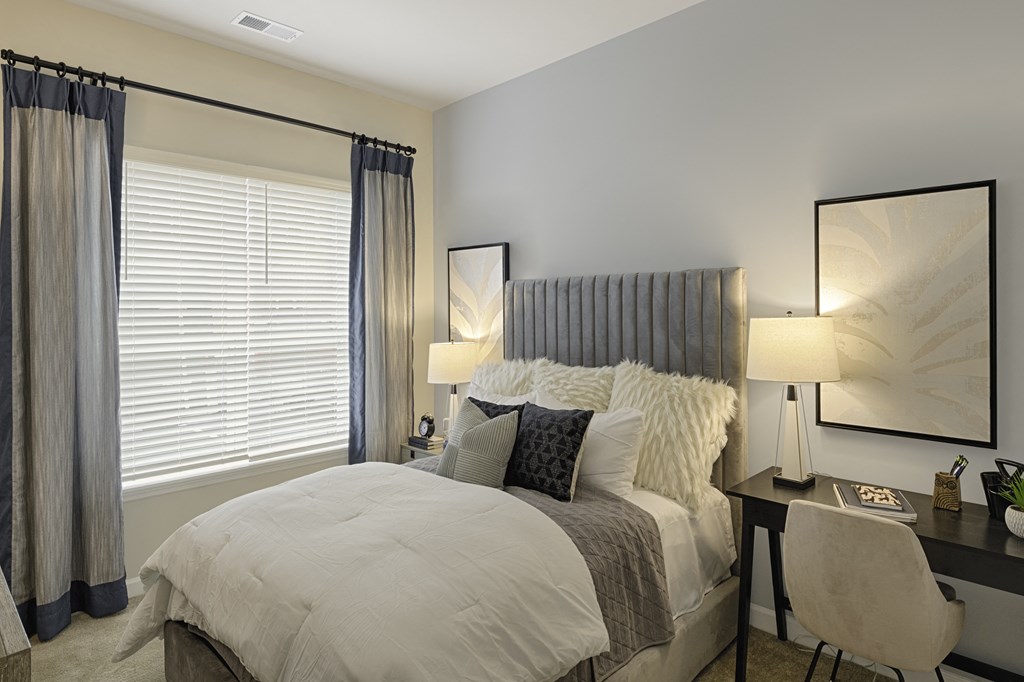 Bedroom with window; carpet