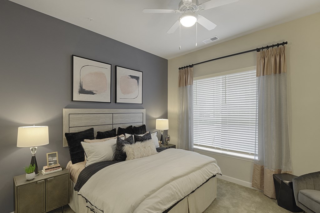 Bedroom with ceiling fan, carpet and window