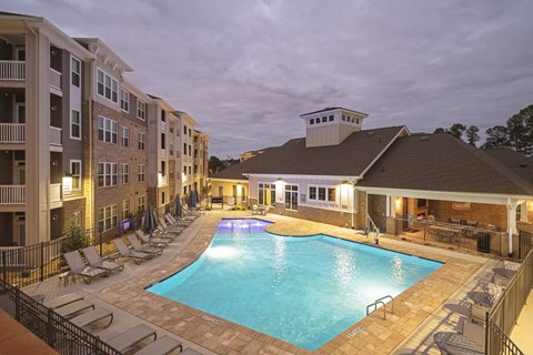a resort style pool with lounge chairs