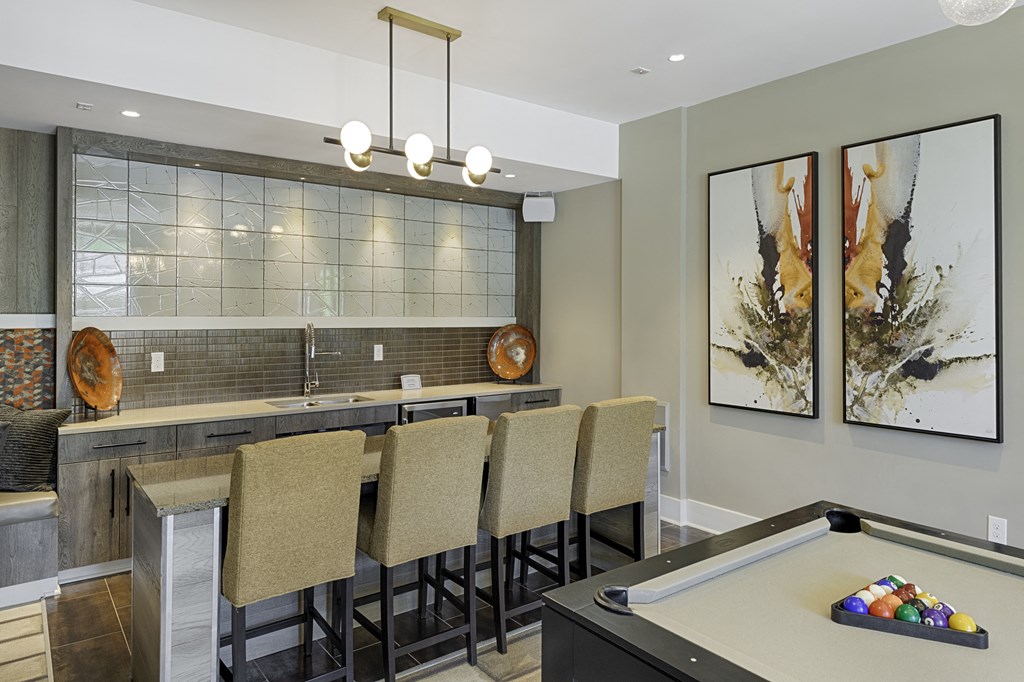 Game room with sink and bar seating