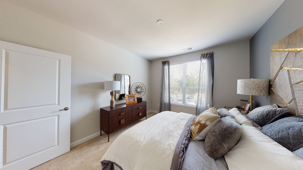 Bedroom with window; carpet