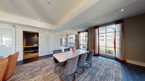 Resident lounge with meeting table and chairs