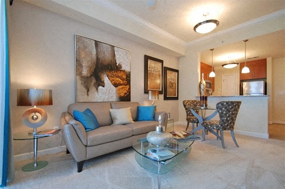 Living room with couch; open to kitchen