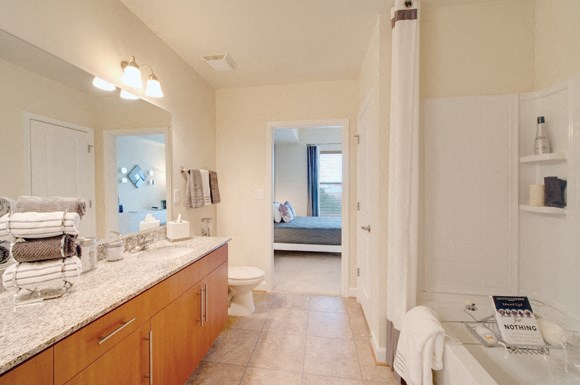 Upgraded master bathroom with granite countertops; garden tub with tile; off master bedroom