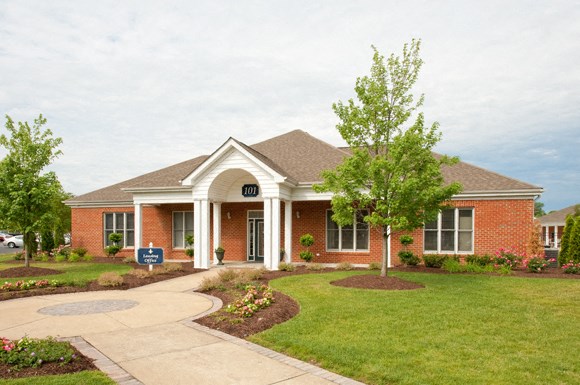 Clubhouse exterior, grass and trees