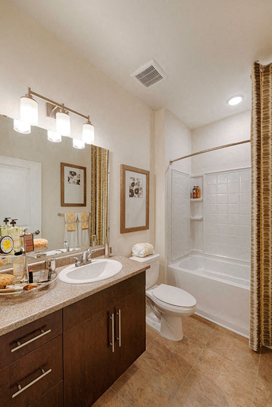 Bathroom with sink, toilet; garden tub available in select homes