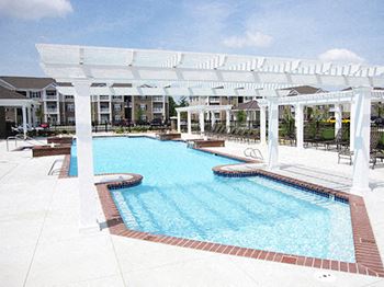 Resort-style pool with pergola