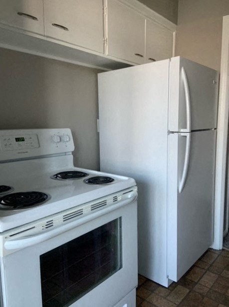 a kitchen with a stove and a refrigerator