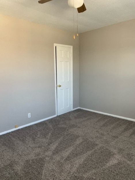 an empty living room with a white door