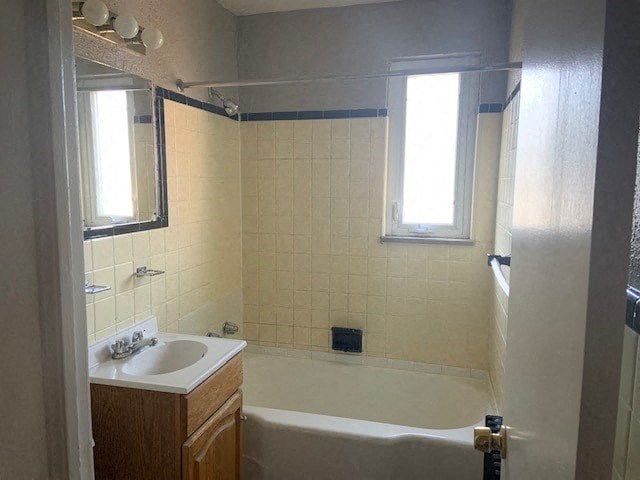 a bathroom with a sink and a bath tub