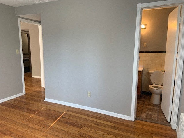 an empty room with a toilet and a bathroom