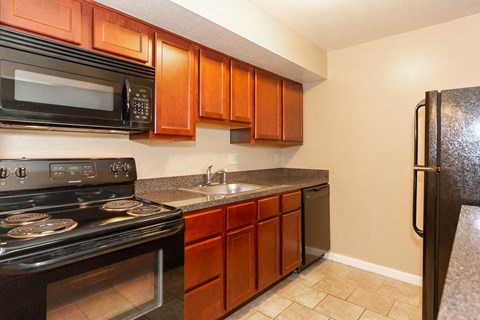 a kitchen with a stove microwave and refrigerator