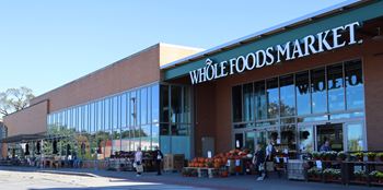 a weigel food market store with a large window display of fruit and vegetables