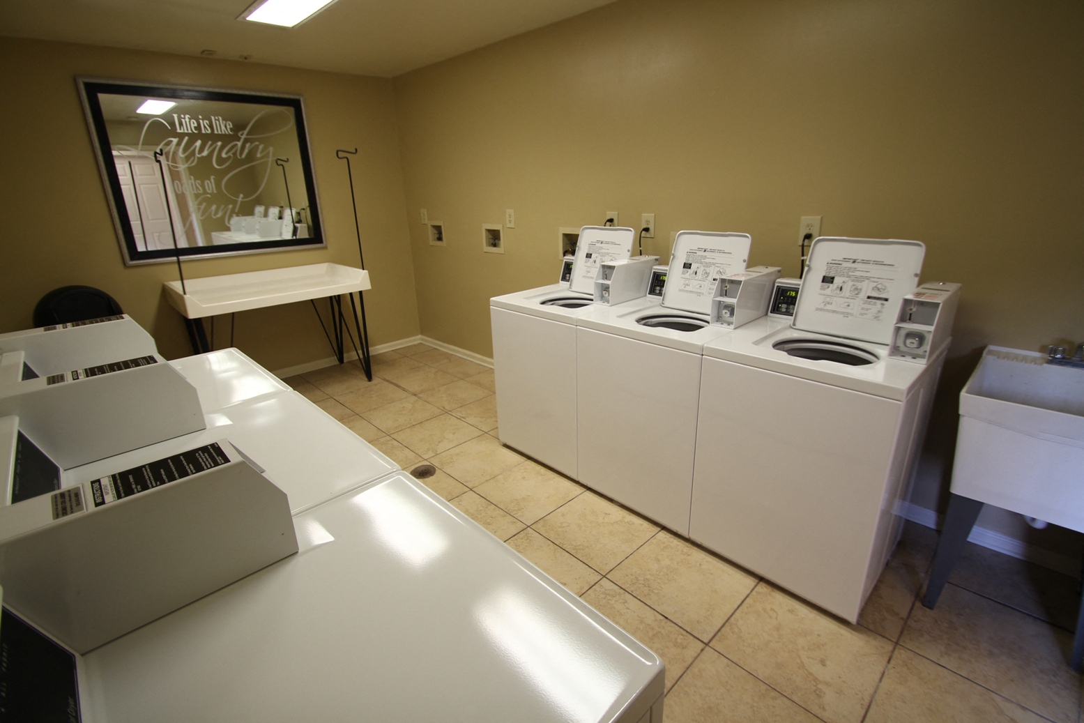This is a photo of the clothes care center at Trails of Saddlebrook Apartments in Florence, KY.