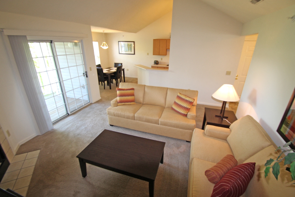 This is photo of the living room of the 852 square foot 1 bedroom Fairlawn at Trails of Saddlebrook Apartments in Florence, KY.