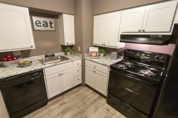 This is a picture of the kitchen in the 823 square foot 2 bedroom apartment at Aspen Village Apartments in Cincinnati, OH. - Photo Gallery 2