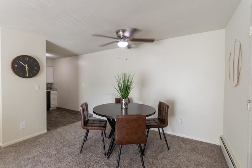 This is a photo of the dining area with ceiling fan in a 560 square foot, 1 bedroom, 1 bath apartment at Aspen Village Apartments in Cincinnati, OH.