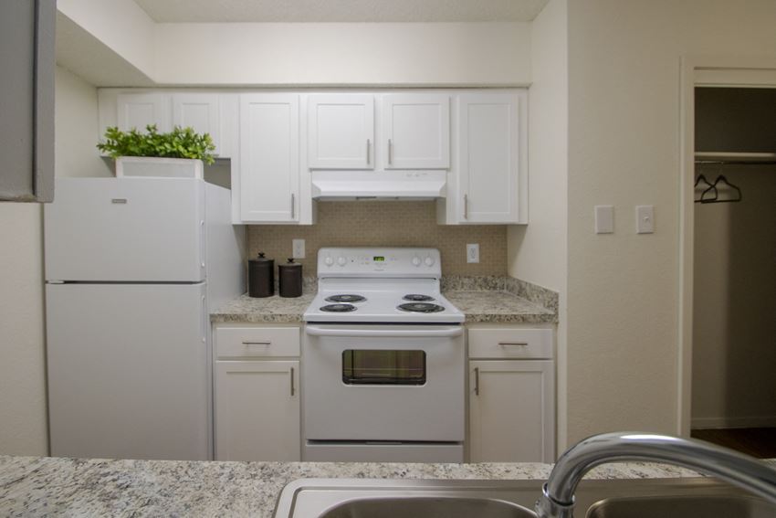 This is a photo of the kitchen in a 704 square foot 1 bedroom apartment at The Boulders Apartments in Garland, TX.