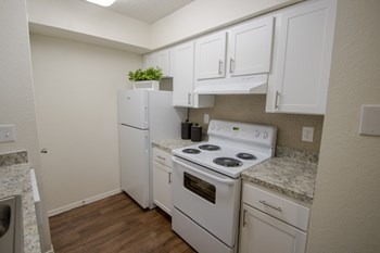 This is a photo of the kitchen in a 704 square foot 1 bedroom apartment at The Boulders Apartments in Garland, TX.