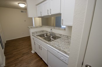 This is a photo of the kitchen in a 704 square foot 1 bedroom apartment at The Boulders Apartments in Garland, TX.