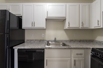 This is a photo of the kitchen in the 543 square foot B-style, 1 bedroom, 1 bath apartment at Blue Grass Manor Apartments in Erlanger, KY. - Photo Gallery 12