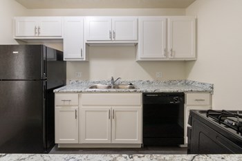 This is a photo of the kitchen in the 543 square foot A-style, 1 bedroom, 1 bath apartment at Blue Grass Manor Apartments in Erlanger, KY. - Photo Gallery 8