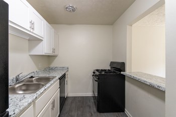 This is a photo of the kitchen in the 543 square foot A-style, 1 bedroom, 1 bath apartment at Blue Grass Manor Apartments in Erlanger, KY. - Photo Gallery 6
