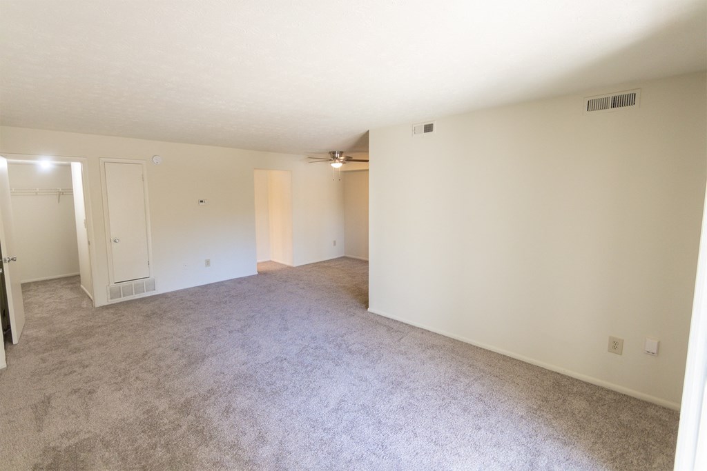This is a photo of the living room in the 899 square foot, 2 bedroom, 1 and a half bath apartment at Blue Grass Manor Apartments in Erlanger, KY.