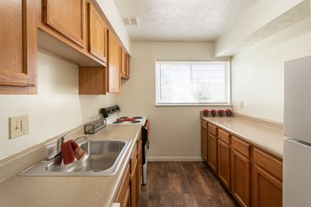This is a photo of the kitchen in the 899 square foot, 2 bedroom, 1 and a half bath apartment at Blue Grass Manor Apartments in Erlanger, KY. - Photo Gallery 2