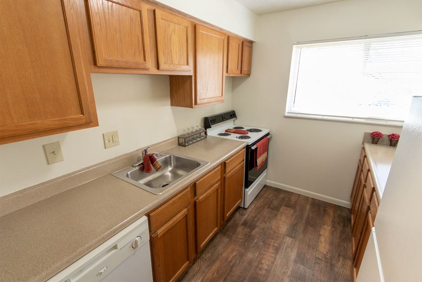 This is a photo of the kitchen in the 899 square foot, 2 bedroom, 1 and a half bath apartment at Blue Grass Manor Apartments in Erlanger, KY. - Photo Gallery 1