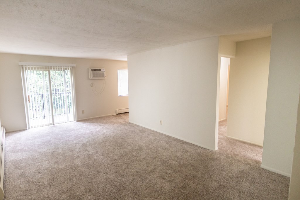 This is a photo of the living room in the 865 square foot, 2 bedroom, 1 and a half bath apartment at Blue Grass Manor Apartments in Erlanger, KY.