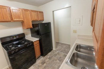 This is a photo of the kitchen in the 865 square foot, 2 bedroom, 1 and a half bath apartment at Blue Grass Manor Apartments in Erlanger, KY. - Photo Gallery 24