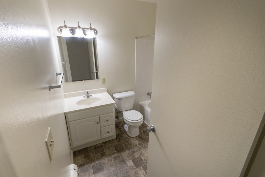 This is a photo of the full bathroom in the 865 square foot, 2 bedroom, 1 and a half bath apartment at Blue Grass Manor Apartments in Erlanger, KY.