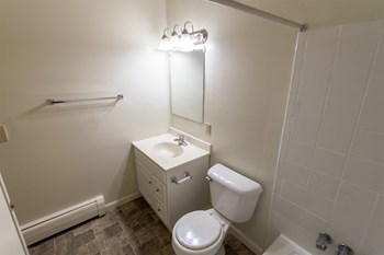 This is a photo of the full bathroom in the 865 square foot, 2 bedroom, 1 and a half bath apartment at Blue Grass Manor Apartments in Erlanger, KY. - Photo Gallery 54
