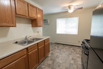 This is a photo of the kitchen and dining room in the 865 square foot, 2 bedroom, 1 and a half bath apartment at Blue Grass Manor Apartments in Erlanger, KY. - Photo Gallery 26