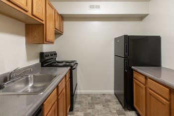 This is a photo of the kitchen of the 902 square foot, 2 bedroom, 1 and a half bath apartment at Blue Grass Manor Apartments in Erlanger, KY. - Photo Gallery 40