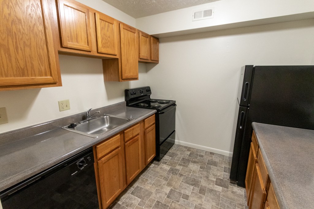 This is a photo of the kitchen of the 902 square foot, 2 bedroom, 1 and a half bath apartment at Blue Grass Manor Apartments in Erlanger, KY.