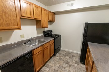 This is a photo of the kitchen of the 902 square foot, 2 bedroom, 1 and a half bath apartment at Blue Grass Manor Apartments in Erlanger, KY. - Photo Gallery 18