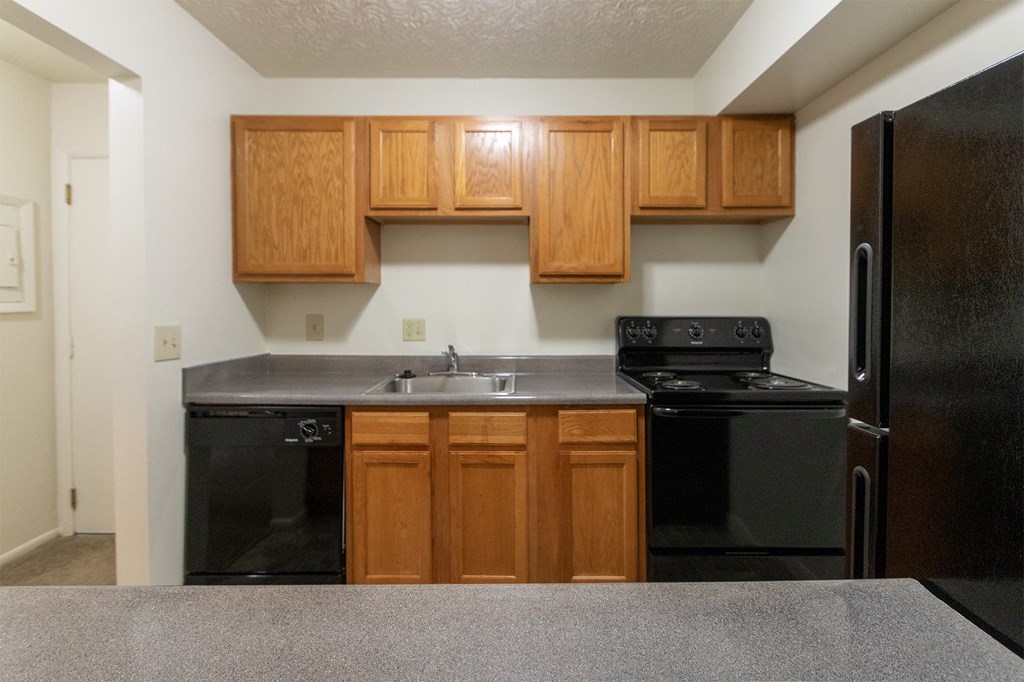 This is a photo of the kitchen of the 902 square foot, 2 bedroom, 1 and a half bath apartment at Blue Grass Manor Apartments in Erlanger, KY.