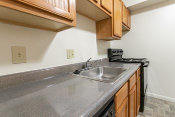 This is a photo of the kitchen of the 902 square foot, 2 bedroom, 1 and a half bath apartment at Blue Grass Manor Apartments in Erlanger, KY. - Photo Gallery 4