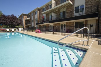 This is a photo of the pool area at Blue Grass Manor apartments in Erlanger KY. - Photo Gallery 33