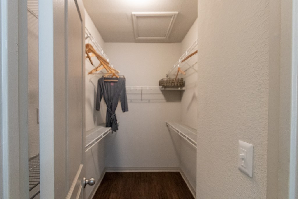 bedroom walk-in closet of the 826 square foot 1 bedroom apartment  at The Brownstones, Texas, 75240