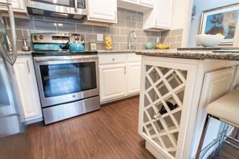 This is a photo of the built-in wine rack in the kitchen of the 826 square foot 1 bedroom , 1 bath apartment at The Brownstones Townhome Apartments in Dallas, TX.