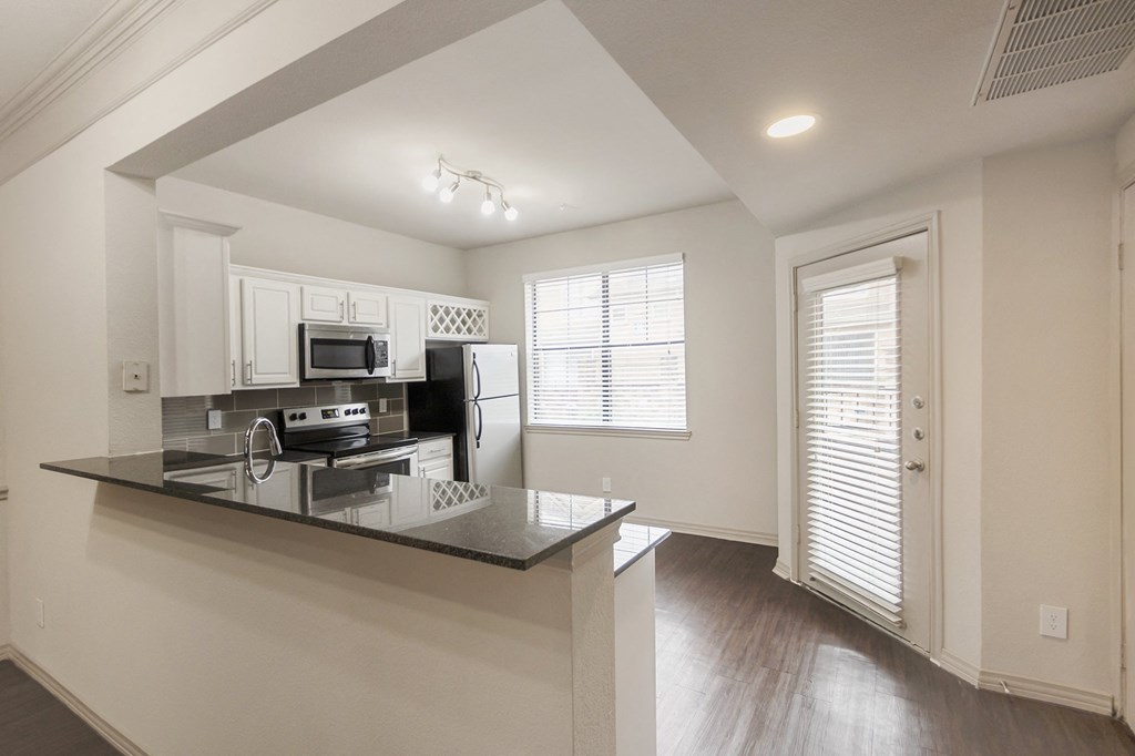 kitchen of the 1320 square foot 2 bedroom, 2 and 1/2 bath floor plan  at The Brownstones, Dallas, TX, 75240