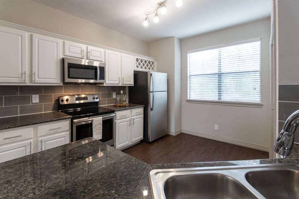 kitchen of the 1486 square foot 3 bedroom, 3 bath floor plan  at The Brownstones, Dallas, 75240