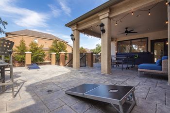 This is a photo of the cornhole court on the game deck at The Brownstones Townhome Apartments in Dallas, TX.