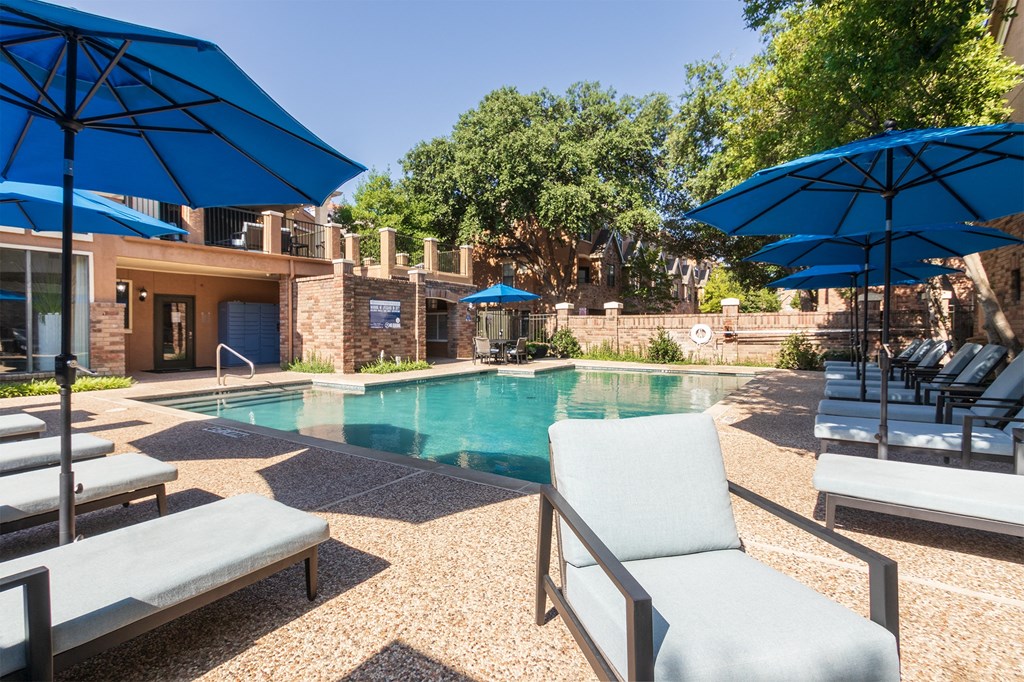 Pool With Relaxing Chairs at The Brownstones, Dallas, 75240