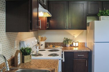 This is a photo of the kitchen of the 590 square foot 1 bedroom model apartment at The Biltmore Apartments in Dallas, TX.