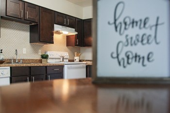 This is a photo of the kitchen of the 590 square foot 1 bedroom model apartment at The Biltmore Apartments in Dallas, TX. - Photo Gallery 2