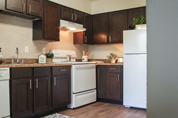 This is a photo of the kitchen of the 590 square foot 1 bedroom model apartment at The Biltmore Apartments in Dallas, TX. - Photo Gallery 3
